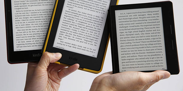 Amazon's Kindle Oasis, far right, the company's sleekest, lightest e-reader, which sells for $290, ...