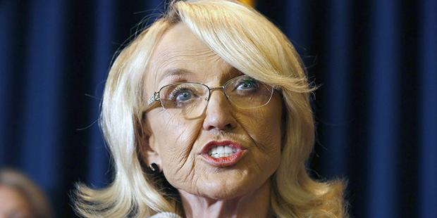 In this Sept. 4, 2013, file photo, Arizona Gov. Jan Brewer speaks in Phoenix. Two online marketing ...