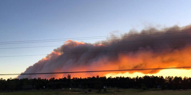 This photo taken Wednesday, June 15, 2016 and provided by Kari Logsdon shows a column of smoke near...