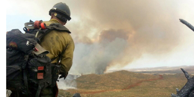In this Sunday, June 30, 2013 file photo made by firefighter Andrew Ashcraft, members of the Granit...