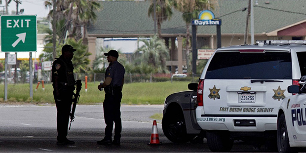 Baton Rouge Police with assault rifles block Airline Highway after police were shot in Baton Rouge,...