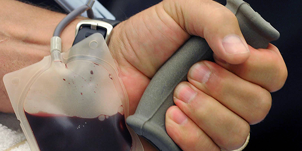FILE - In this July 19, 2010 file photo, blood is collected during a blood drive at Saint Vincent H...