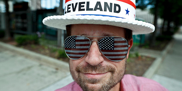 Andy Sandy wears an RNC hat and pair of American flag glasses while walking around, Sunday, July 17...