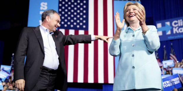 Democratic presidential candidate Hillary Clinton and Sen. Tim Kaine, D-Va., take the stage at a ra...