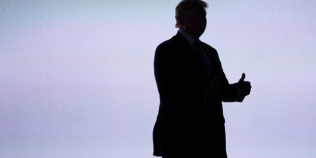 Republican presidential candidate Donald Trump gives a thumbs up as he arrives to introduce his wif...