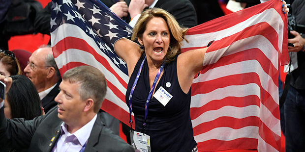 Delegates react as some delegates call for a roll call vote on the adoption of the rules during the...