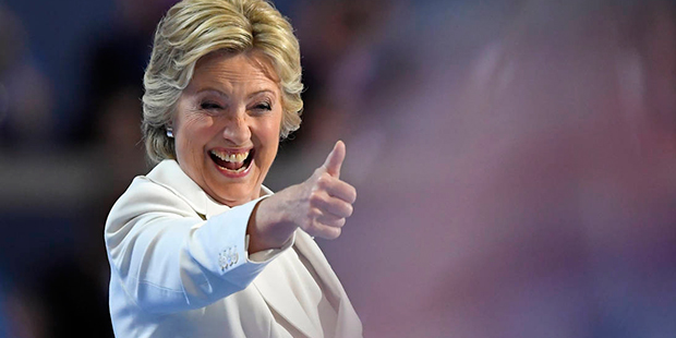 Democratic presidential nominee Hillary Clinton give a thumbs up after taking the stage to make her...
