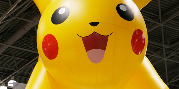 FILE - In this Feb. 16, 2014 file photo, a Pikachu of Pokemon display hangs above Toy Fair 2014 at ...