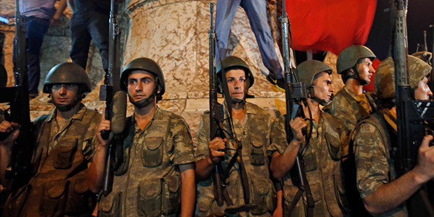 Turkish soldiers secure the area as supporters of Turkey's President Recep Tayyip Erdogan protest i...