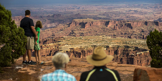 In this Wednesday, Aug. 24, 2016 photo, visitors look at Grand View Point in the Island in the Sky ...