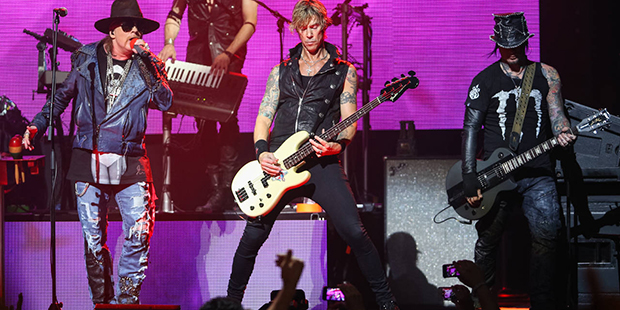 FILE - In this April 23, 2014 file photo, Axl Rose, from left, Duff McKagan and DJ Ashba of Guns N'...