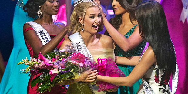 In this July 30, 2016 photo, Miss Texas Karlie Hay is crowned and given flowers as the new Miss Tee...