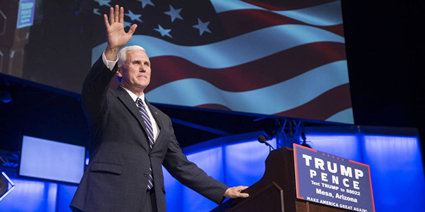 Republican vice presidential nominee Mike Pence waves to the crowd during a rally at Living Word Bi...