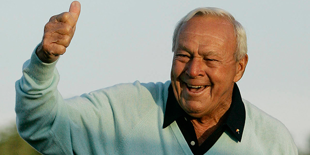 File- This April 5, 2007, file photo shows former Masters champion Arnold Palmer acknowledging the ...