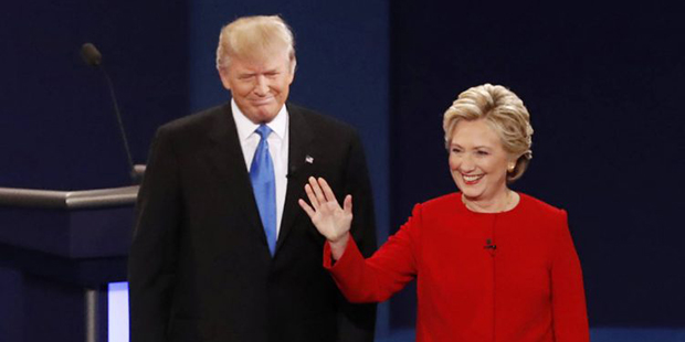 Democratic presidential nominee Hillary Clinton, right, stands with Republican presidential nominee...