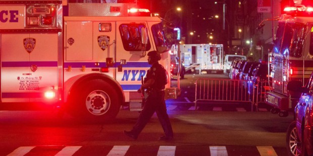 Heavily armed police guard the area as they search for an explosive device on West 27th Street and ...