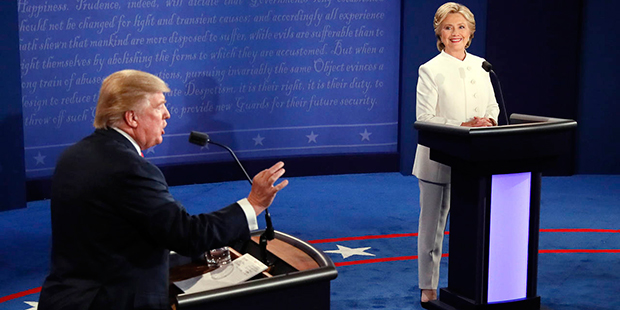 Democratic presidential nominee Hillary Clinton laughs with Republican presidential nominee Donald ...
