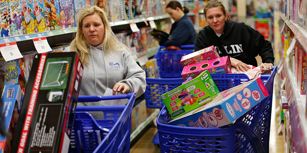 FILE - In this Friday, Nov. 27, 2015, file photo, cousins Stacy Levine, left, and Melissa Bragg sho...