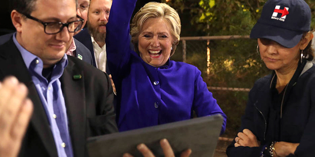 Democratic presidential candidate Hillary Clinton watches the World Series baseball game between th...