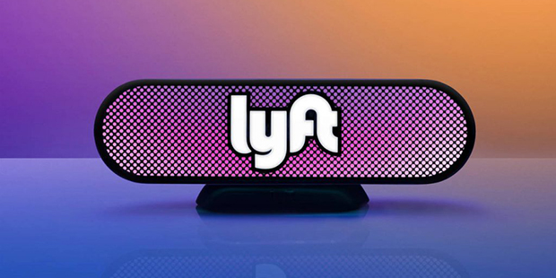 This undated photo provided by Lyft shows an illuminated Lyft beacon. Ride-hailing service Lyft, th...