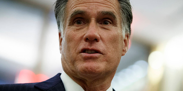 Former Republican presidential nominee Mitt Romney talks with reporters after eating dinner with Pr...