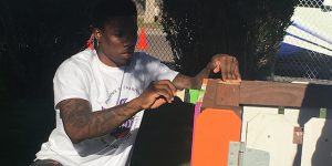 Phoenix Suns' Eric Bledsoe does his part in helping build a playground in the Guadalupe Barrio Nuevo community Monday, Dec. 12, 2016. (Photo by Sharon Mittelman/KTAR News)