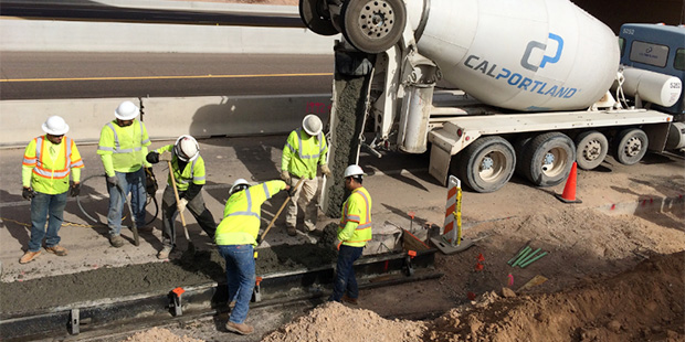 Arizona Department of Transportation officials begin pouring concrete for the South Mountain Freewa...