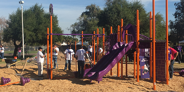 Over 200 volunteers, including Phoenix Suns players and coaches, helped build a new playground in t...