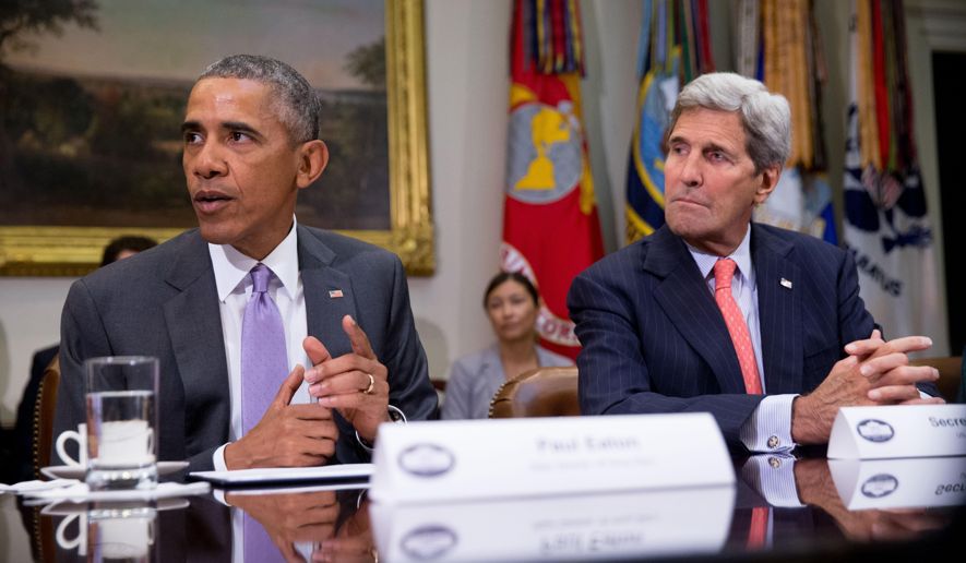 President Obama, accompanied by Secretary of State John Kerry, meets with veterans and Gold Star Mothers to discuss the Iran nuclear deal in the Roosevelt Room at the White House in Washington on Sept. 10, 2015. (AP Photo)