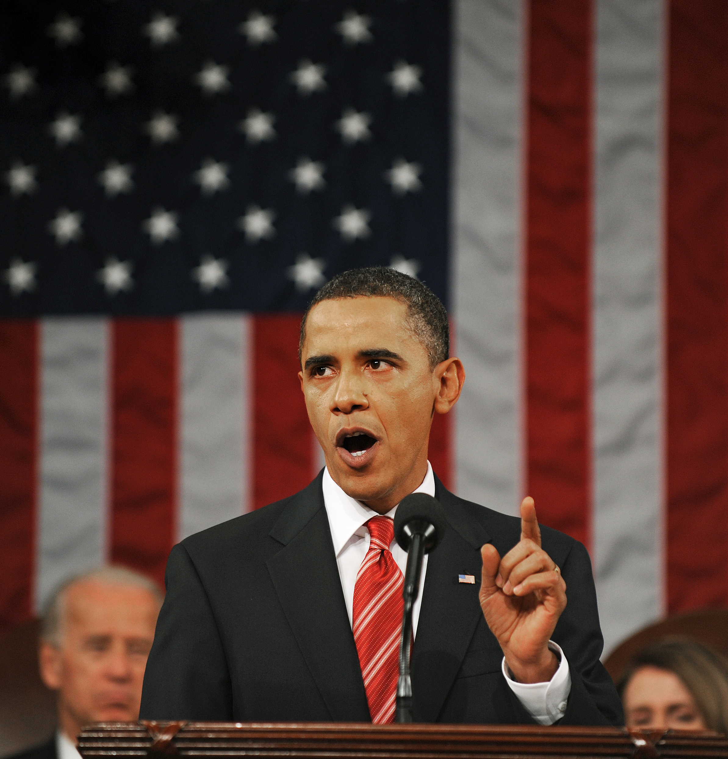 President Barack Obama delivers his State of the Union address on Capitol Hill in Washington, Wednesday, Jan. 27, 2010. Vice President Joe Biden and House Speaker Nancy Pelosi are seen in the background. (AP Photo/Tim Sloan, Pool)