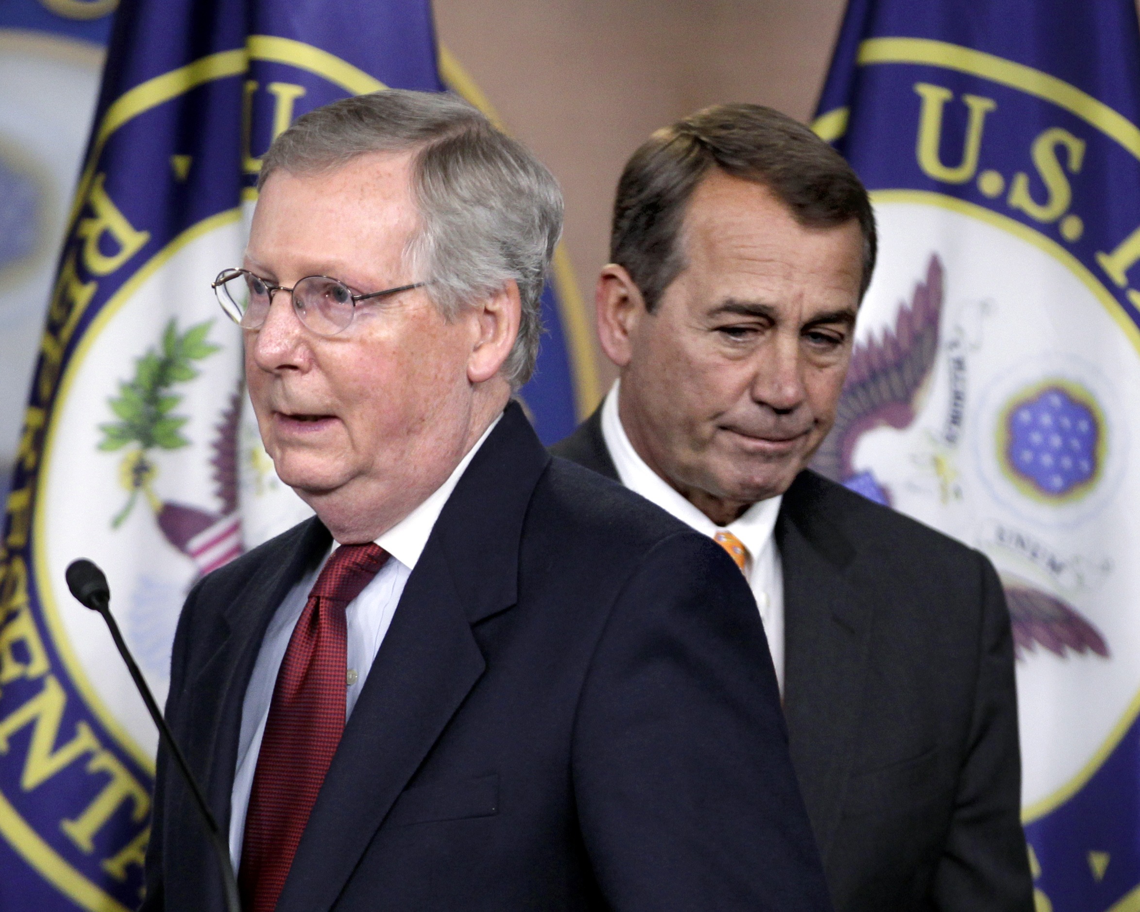 House Republican leader John Boehner of Ohio, right, and Senate Minority Leader Mitch McConnell of Ky., left, swap positions at the microphones to answer questions on the sweeping GOP victory in the 2010 midterm elections, Wednesday, Nov. 3, 2010, during a news conference on Capitol Hill in Washington . (AP Photo/J. Scott Applewhite)