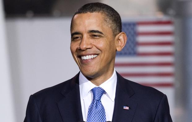 President Barack Obama smiles during an event to promote clean energy vehicles, Friday, April 1, 2011, at a UPS facility in Landover, Md. (AP Photo/Evan Vucci)