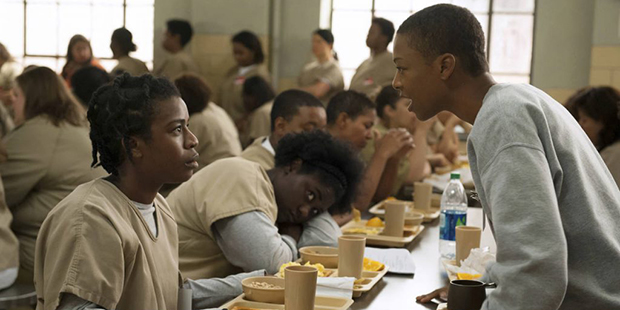 FILE - In this file image released by Netflix, Uzo Aduba, left, and Samira Wiley appear in a scene ...
