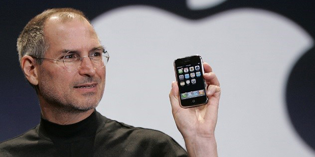 In this Jan. 9, 2007 file phtoo, Apple CEO Steve Jobs holds up an Apple iPhone at the MacWorld Conf...