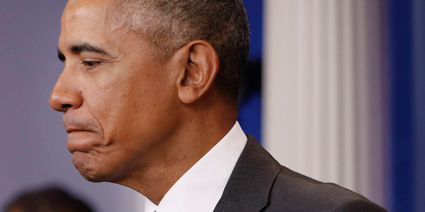 President Barack Obama pauses while speaking at White House press secretary Josh Earnest's final da...