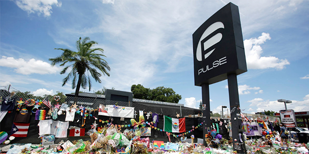 This Monday, July 11, 2016 photo shows a makeshift memorial outside the Pulse nightclub, a month af...