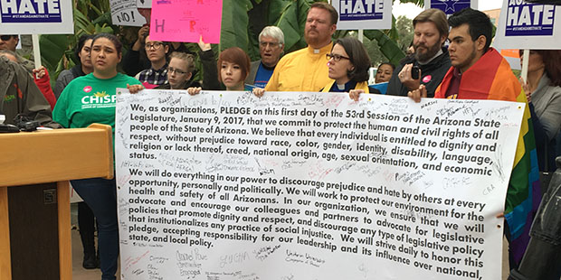 About 200 people gathered outside of the Arizona State Capitol in their United Against Hate coalition to get legislators and Gov. Doug Ducey to sign a pledge on Monday, Jan. 9, 2016. (Photo by Sharon Mittelman/KTAR News)