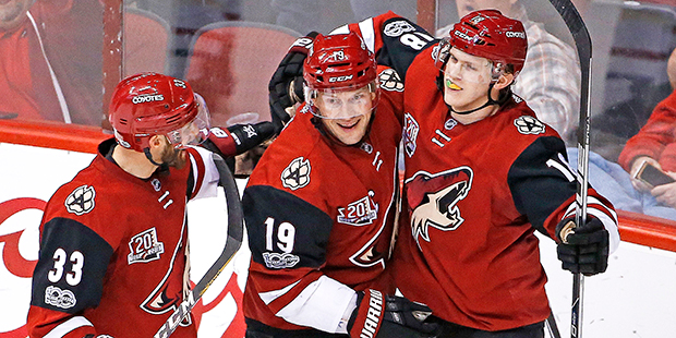 Arizona Coyotes center Christian Dvorak, right, celebrates his goal against the Montreal Canadiens ...