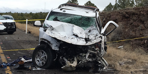 The carjacking suspect is in critical condition after he crashed a GMC SUV head-on a semi-truck. (P...