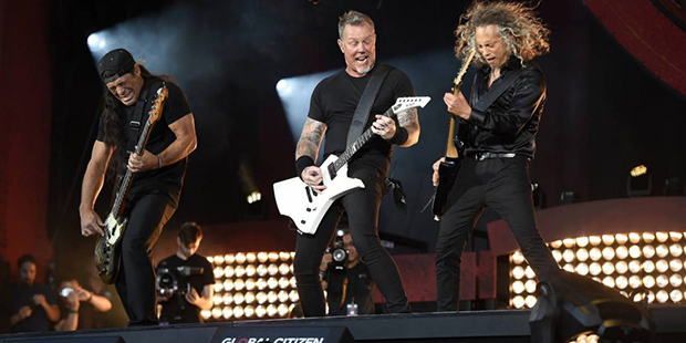 Musicians Robert Trujillo, left, James Hetfield and Kirk Hammett of Metallica perform at the 2016 G...
