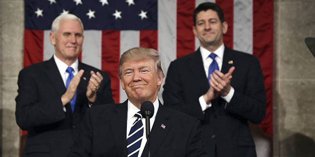President Donald Trump, flanked by Vice President Mike Pence and House Speaker Paul Ryan of Wis., a...