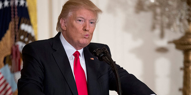President Donald Trump pauses while speaking during a news conference, Thursday, Feb. 16, 2017, in ...