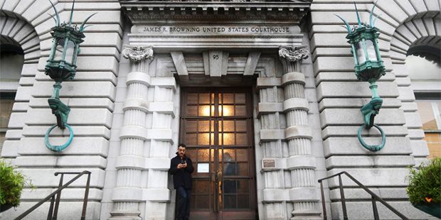 A man stands outside the main door outside the 9th U.S. Circuit Court of Appeals building Thursday,...