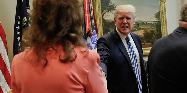 President Donald Trump greets, from left, Kim Sertich, from Arizona; Elias Seife, from Florida; and...