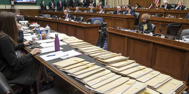 Folders containing amendments to the GOP's "Obamacare" replacement bill are spread on a conference ...