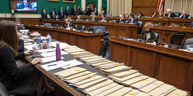Folders containing amendments to the GOP's "Obamacare" replacement bill are spread on a conference ...