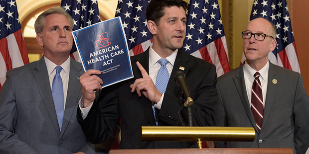 House Speaker Paul Ryan of Wis., center, standing with Energy and Commerce Committee Chairman Greg ...