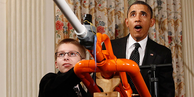 President Barack Obama reacts as Phoenix teen Joey Hudy launches a marshmallow from his Extreme Mar...