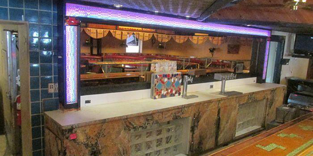 A bar is up for auction as Macayo's is getting set to relocate....