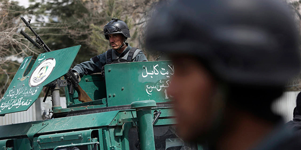 Security forces inspect the site of attack on a military hospital in Kabul, Afghanistan, Wednesday,...